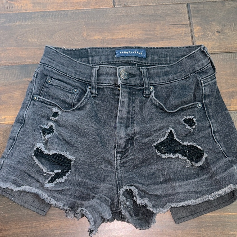 black ripped jean shorts